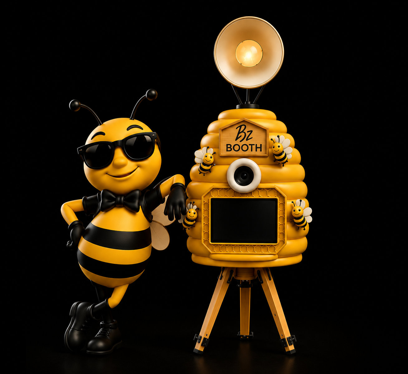BZ BOOTH bee mascot in a tuxedo beside a gold magazine-cover photo booth